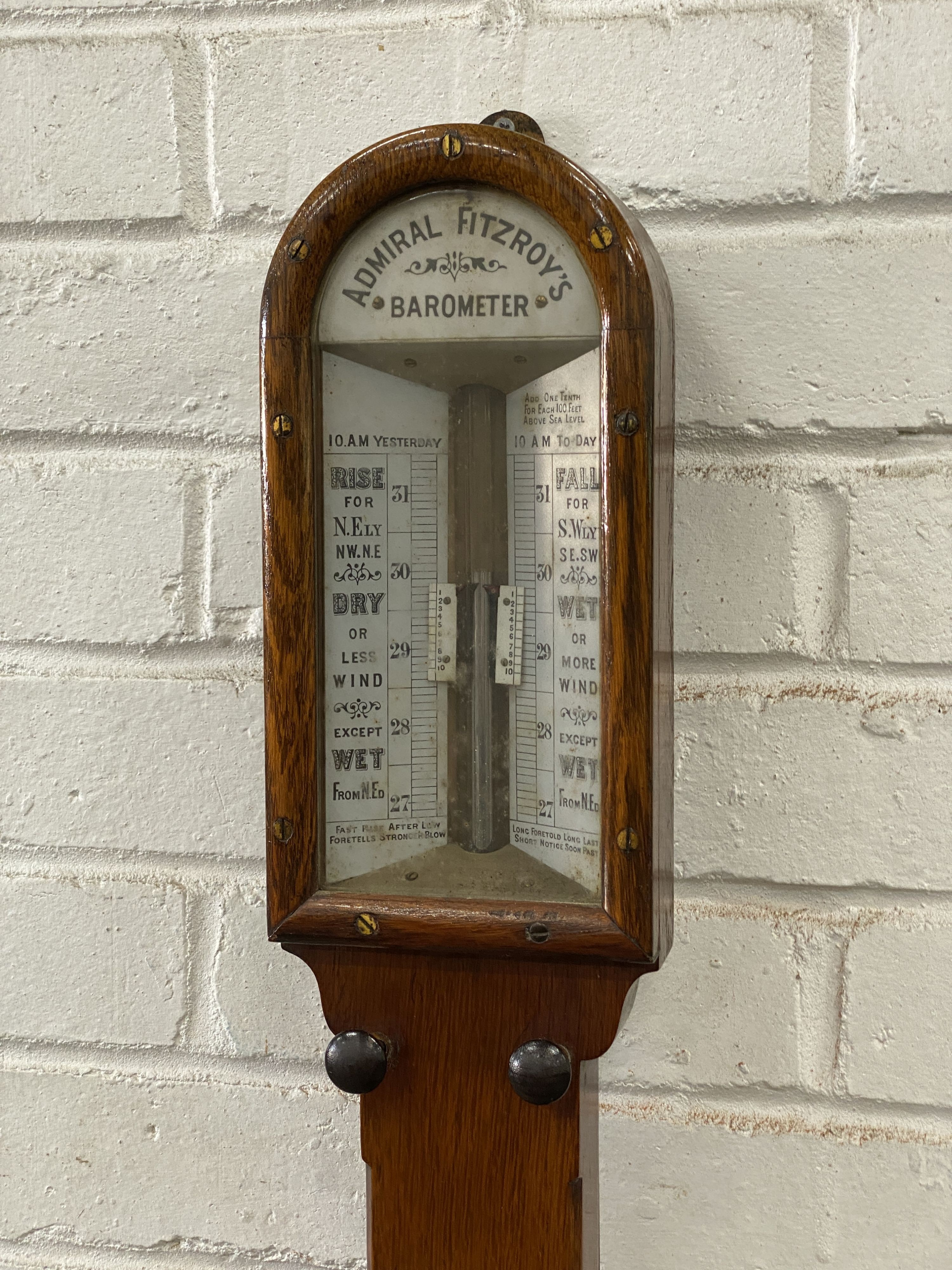 A Victorian oak cased Admiral Fitzroy’s stick barometer and thermometer, height 102cm